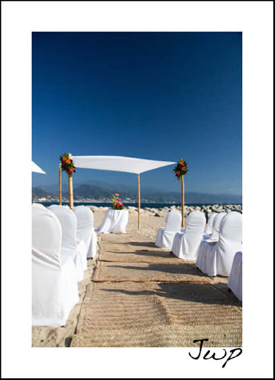 A small canopy or better yet a chuppah draped with white cloth is a simple